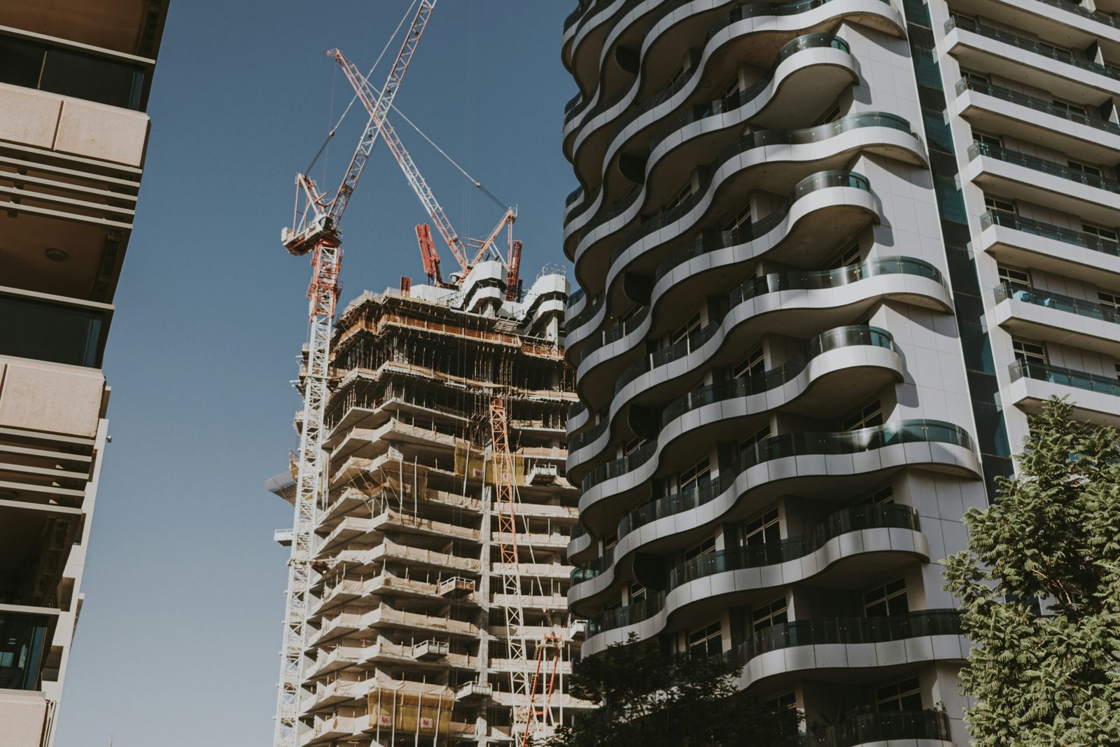 A couple of tall buildings next to each other